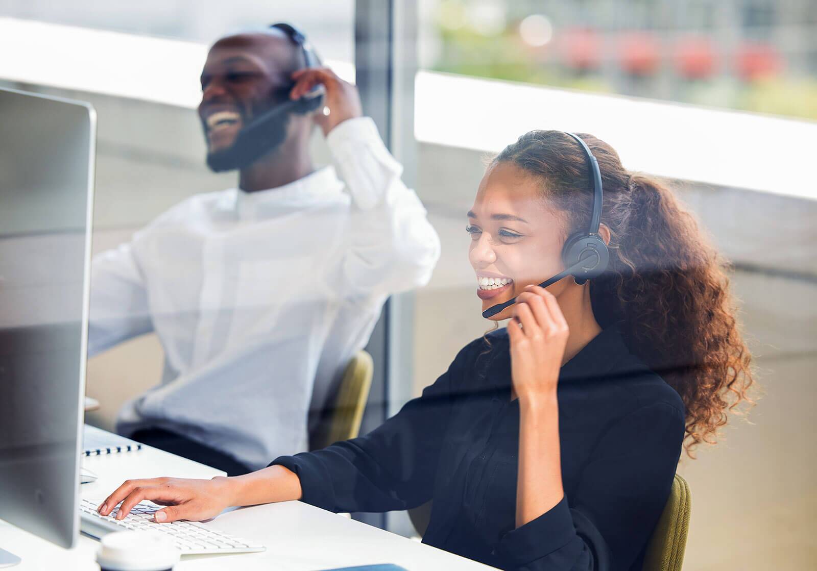 Man and woman working in a call center.