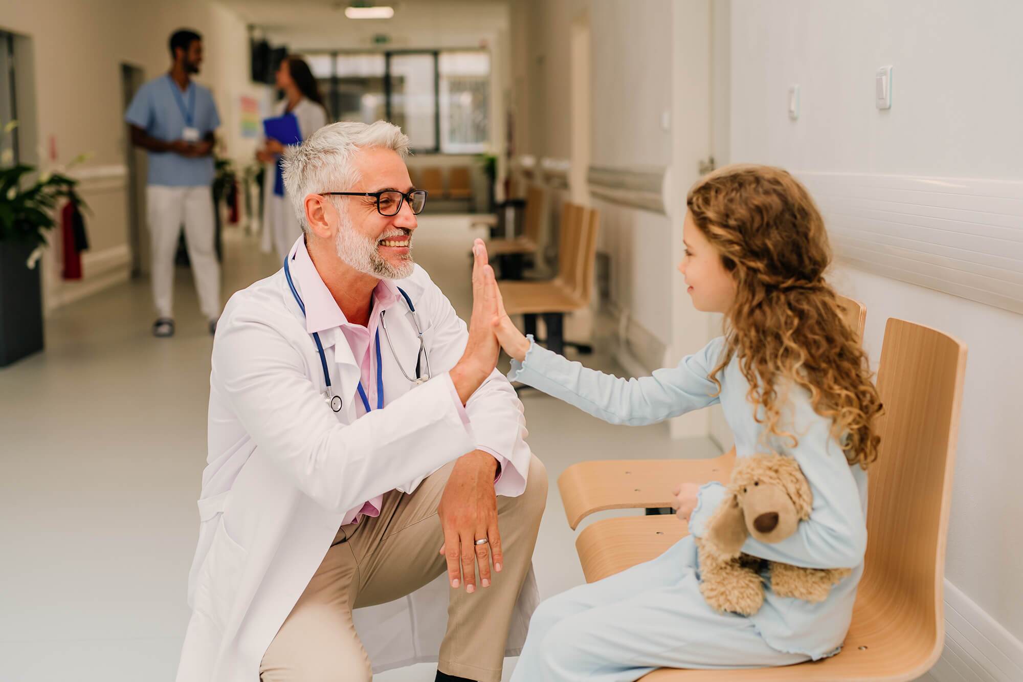 doctor-playing-with-his-little-patient-at-pediatri-2024-10-20-18-38-19-utc-2.jpg