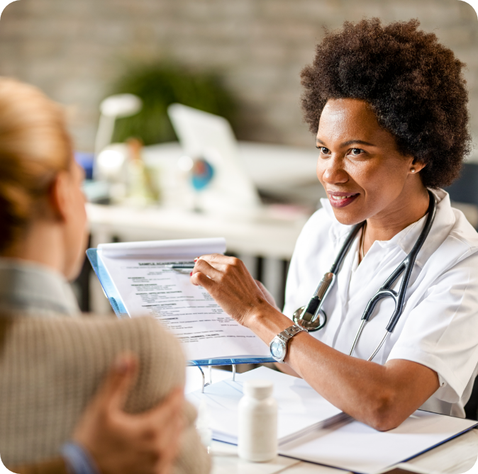 smiling-african-american-doctor-showing-to-a-coupl-2024-12-13-22-01-33-utc-3.webp